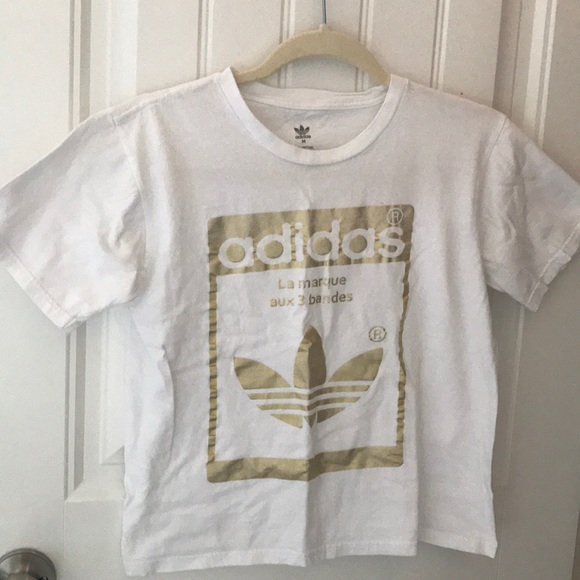 gold and white adidas shirt